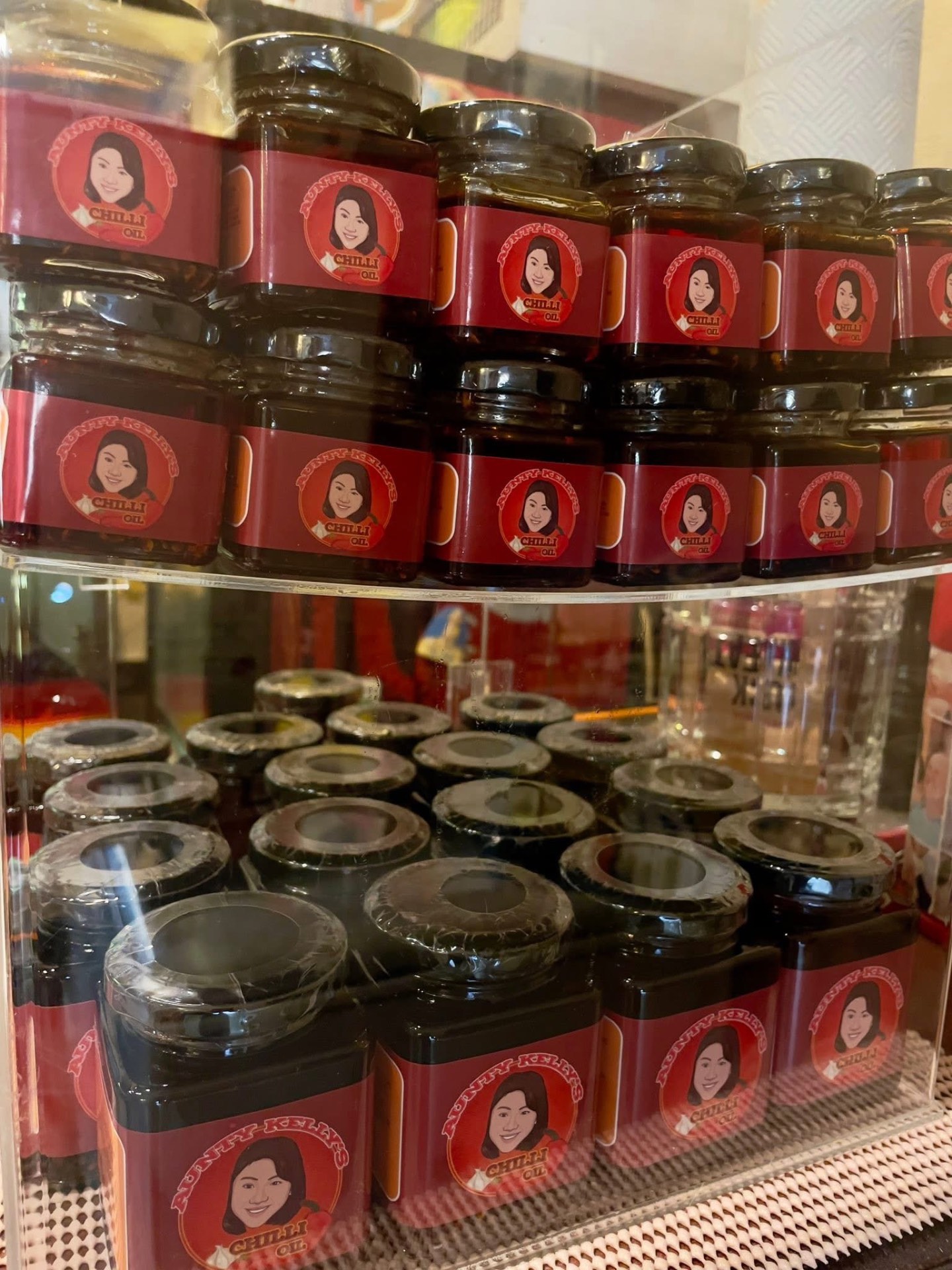 Aunty Kelly's Chilli Oil jars on display